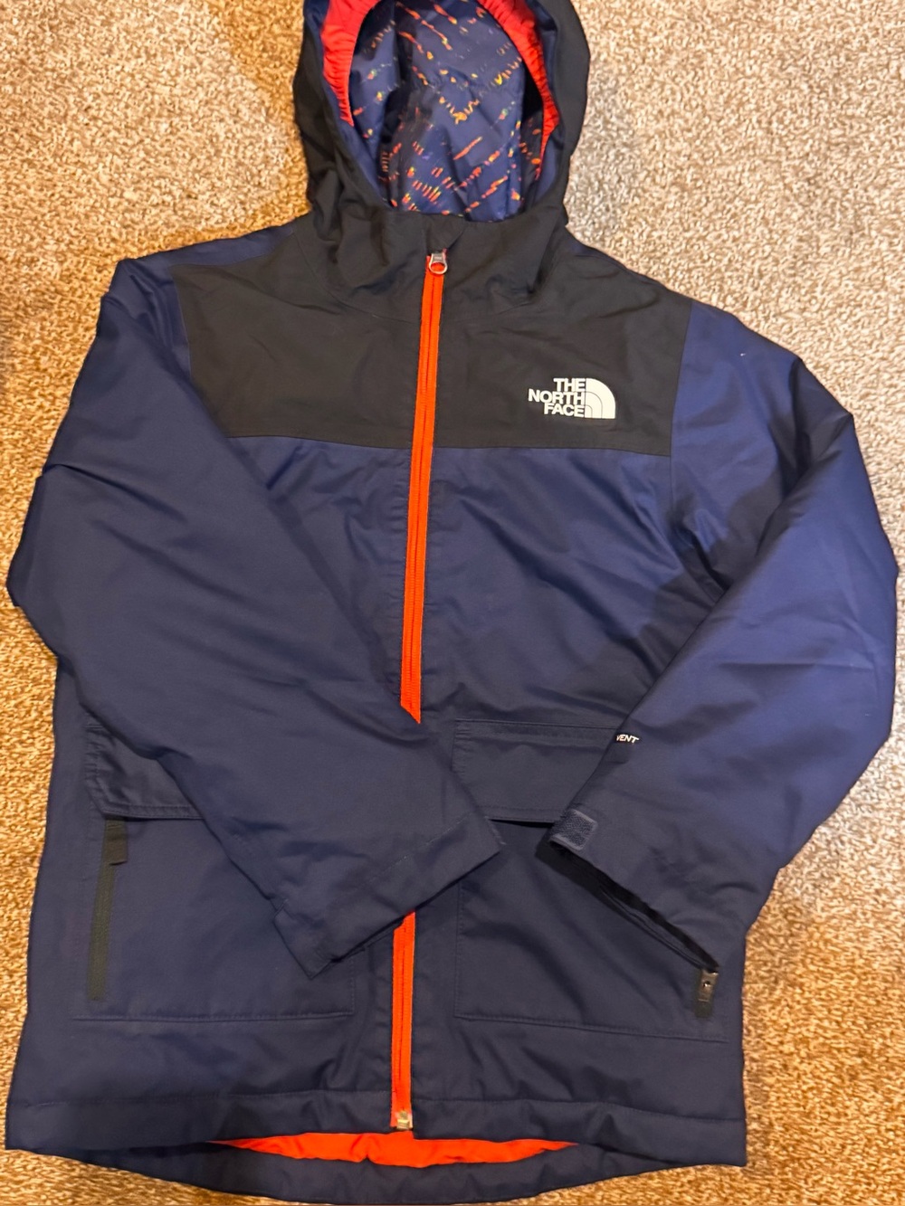 The North Face Navy and Black Hooded Raincoat with Red Trim
